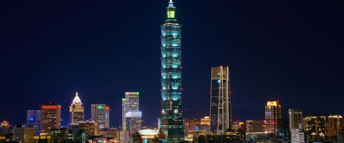 pexels-photo-1717859-1717859 Illuminated Taipei 101 and city skyline at night showcasing modern urban architecture.
